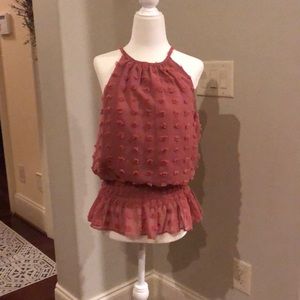 South moon under sleeveless top.